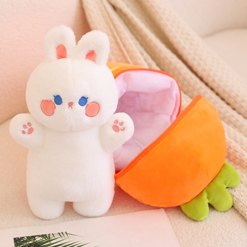 White bunny plush with paw details inside orange carrot pod, zipper front open
