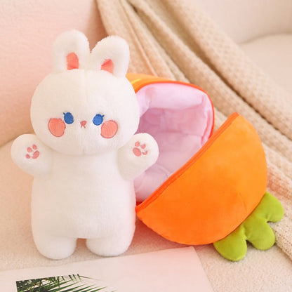White bunny plush with paw details inside orange carrot pod, zipper front open