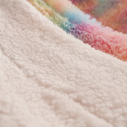 Fluffy white sherpa fabric close-up with a hint of pastel rainbow stripe