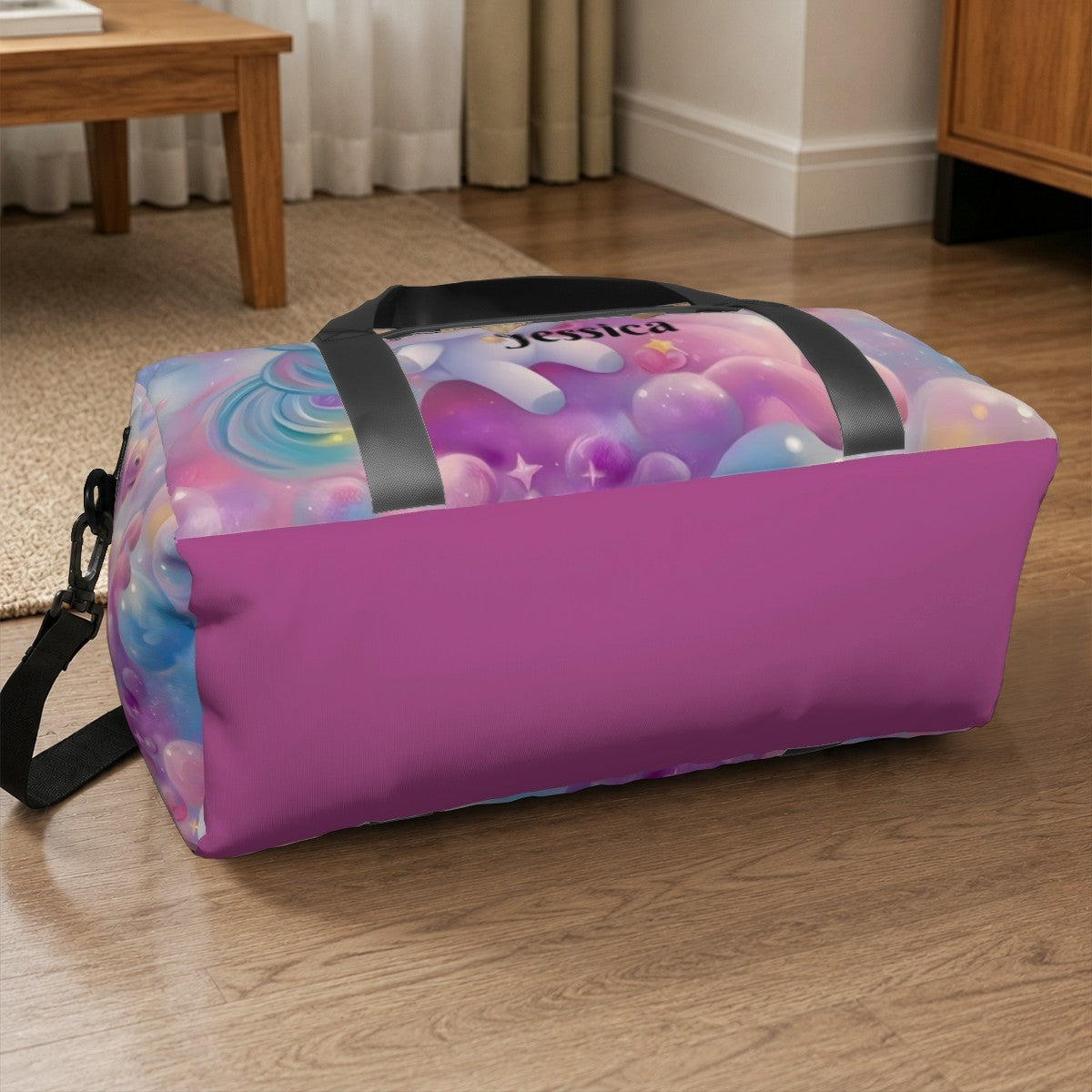 Pastel unicorn duffel bag with black straps and zip top, name patch on front