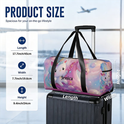 Pastel unicorn duffel bag with black straps on top of rolling suitcase