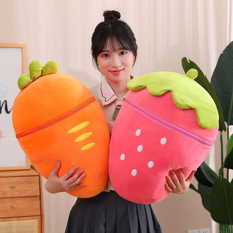 Fruit plush pair: orange carrot pod and pink strawberry pod, each with green leafy top