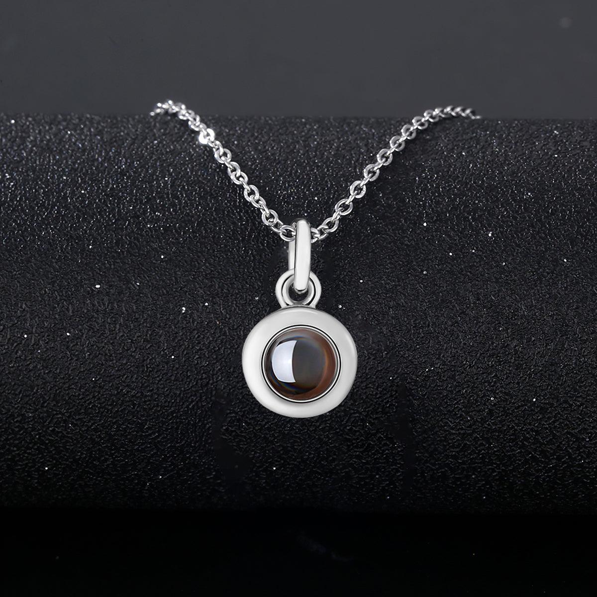 Silver photo projection necklace with round locket pendant and link chain