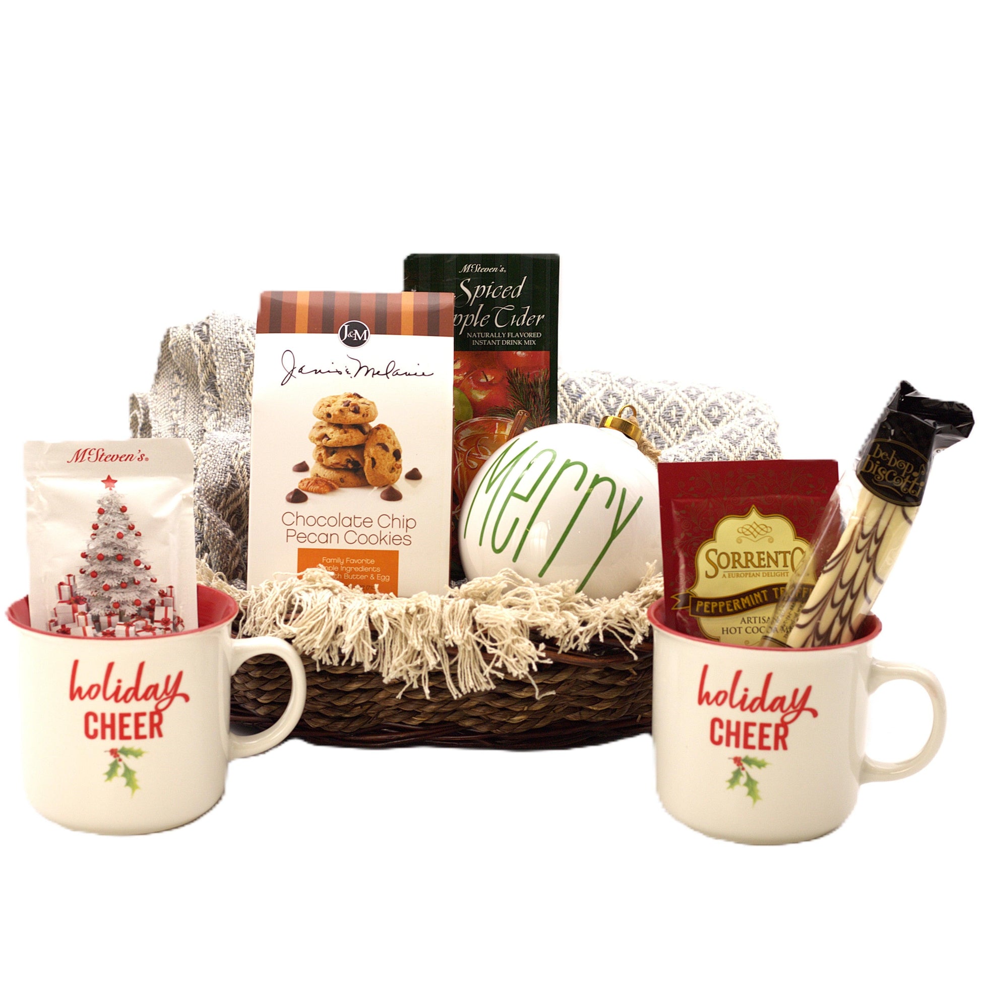 Holiday gift basket with two mugs, cookie box, cider carton, and candy.