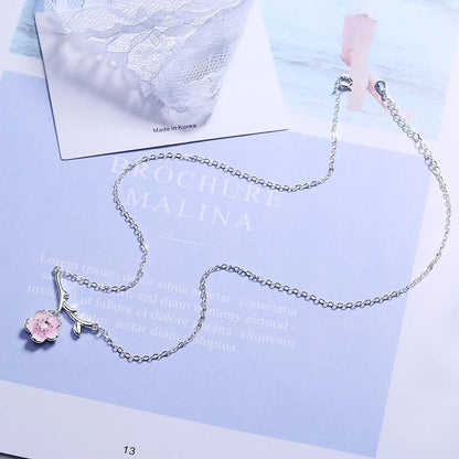 Silver cherry blossom pendant necklace with pink flower charm on extended chain