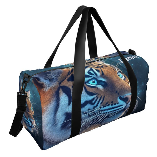Blue duffel bag with tiger face print, black carry handles and side zipper pocket.