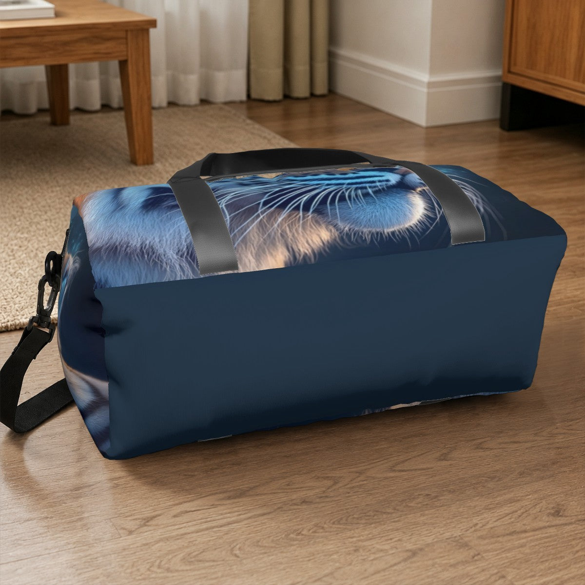 Navy duffel bag with tiger print, black webbing straps and top carry handle.