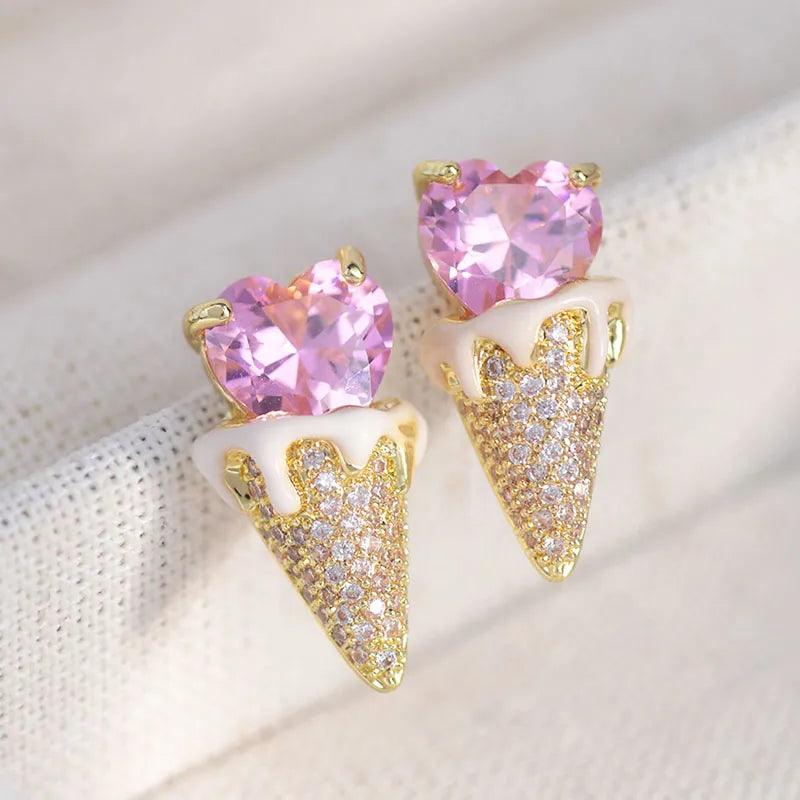 Pink heart top with gold-tone triangular glitter earrings, stud-to-drop style