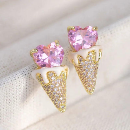 Pink heart top with gold-tone triangular glitter earrings, stud-to-drop style
