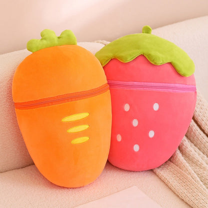Pair of fruit animal plushies: orange carrot pod and pink strawberry pod with green leafy tops
