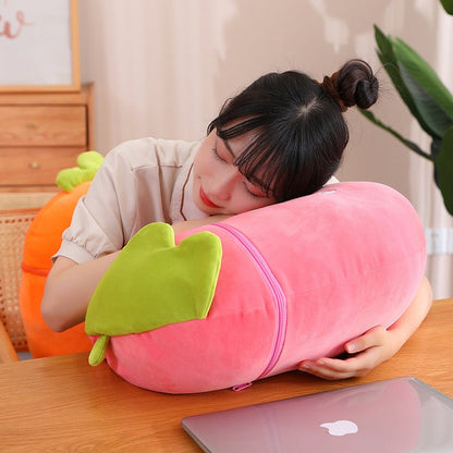 Two fruit animal plushies: orange carrot pod and pink strawberry pod with green tops