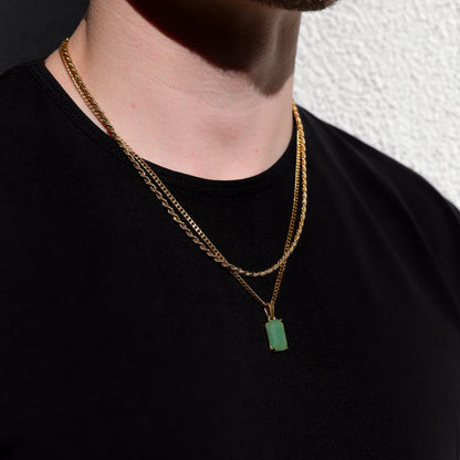Gold-tone layered chain necklace with square green stone pendant