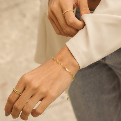 Gold paperclip chain bracelet with adjustable extender on wrist