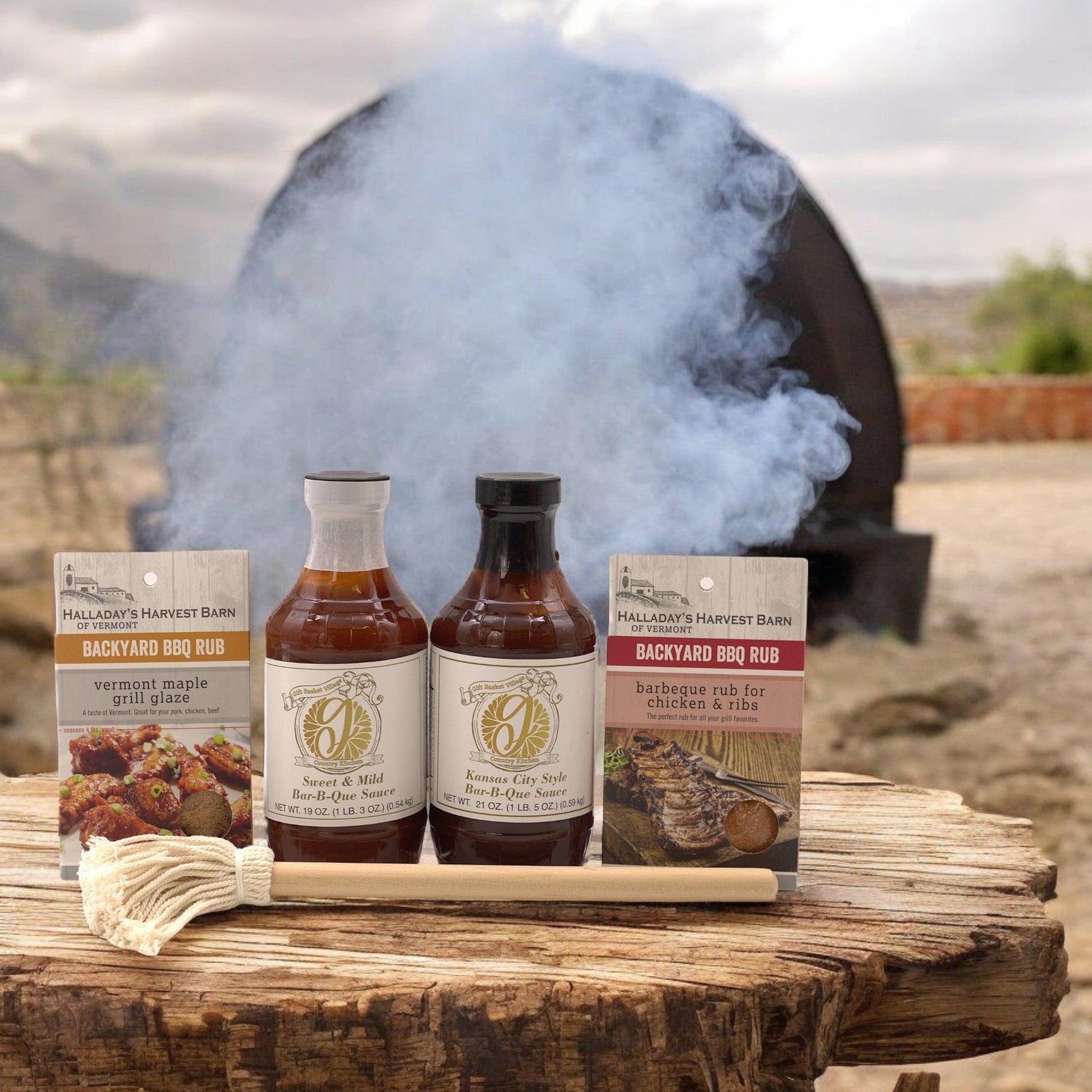BBQ gift set with two bar-b-que sauce bottles, two BBQ rub packets, and wooden brush