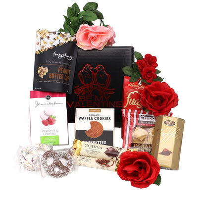 Valentine gift box with black packaging, assorted sweets, and red and pink roses on top