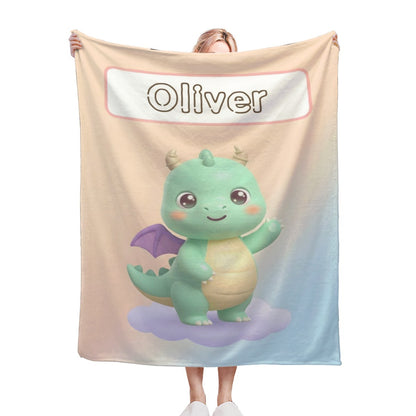 White flannel blanket with cute green dragon mascot and “Oliver” logo
