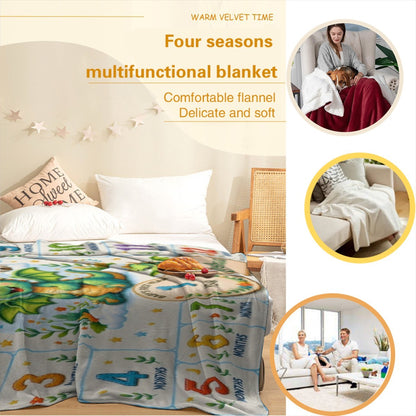 Milestone dragon blanket on bed, blue-white pattern with green dragons and numbers