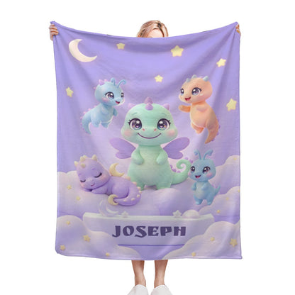 Purple kids blanket with cartoon dragons, stars, moon, and 'JOSEPH' text