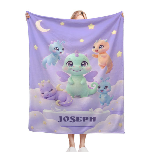 Purple kids blanket with cartoon dragons, stars, moon, and 'JOSEPH' text