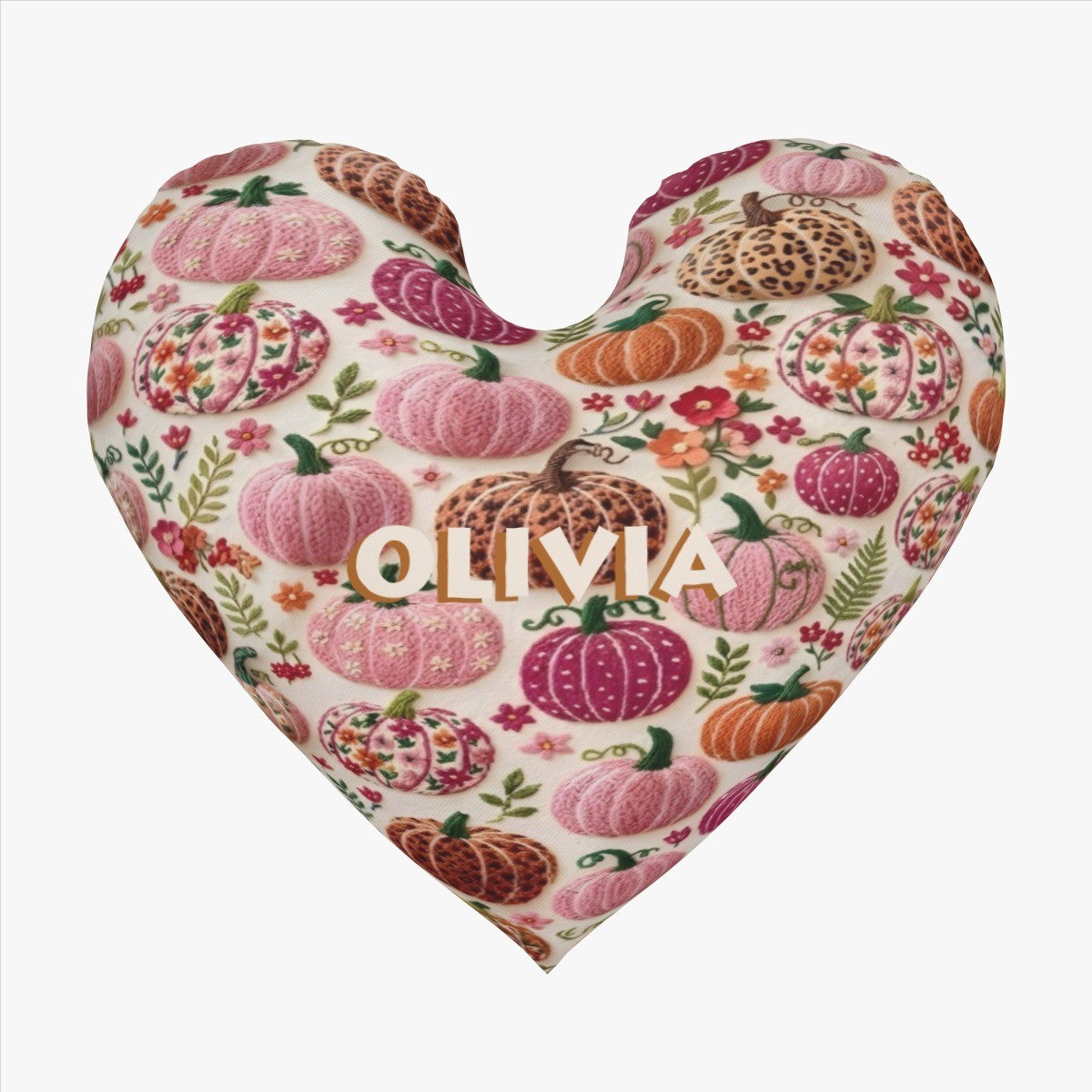 Heart-shaped pillow on cream with fall pumpkin floral pattern and OLIVIA