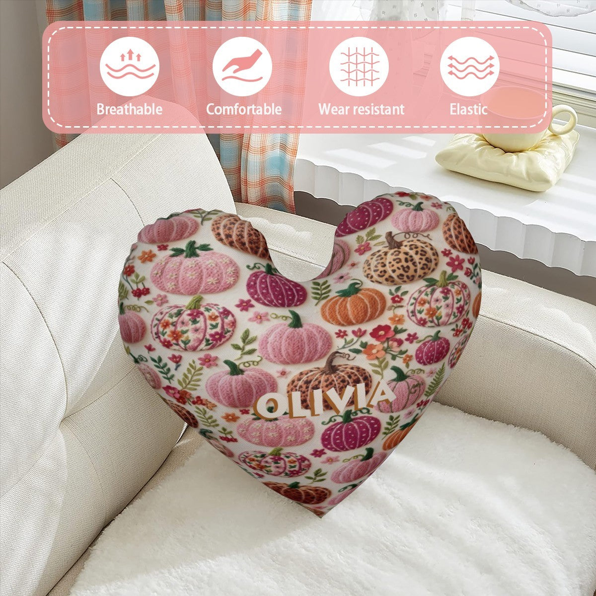 Heart-shaped decorative pillow in cream with pumpkin floral pattern and OLIVIA