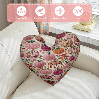 Heart-shaped decorative pillow in cream with pumpkin floral pattern and OLIVIA