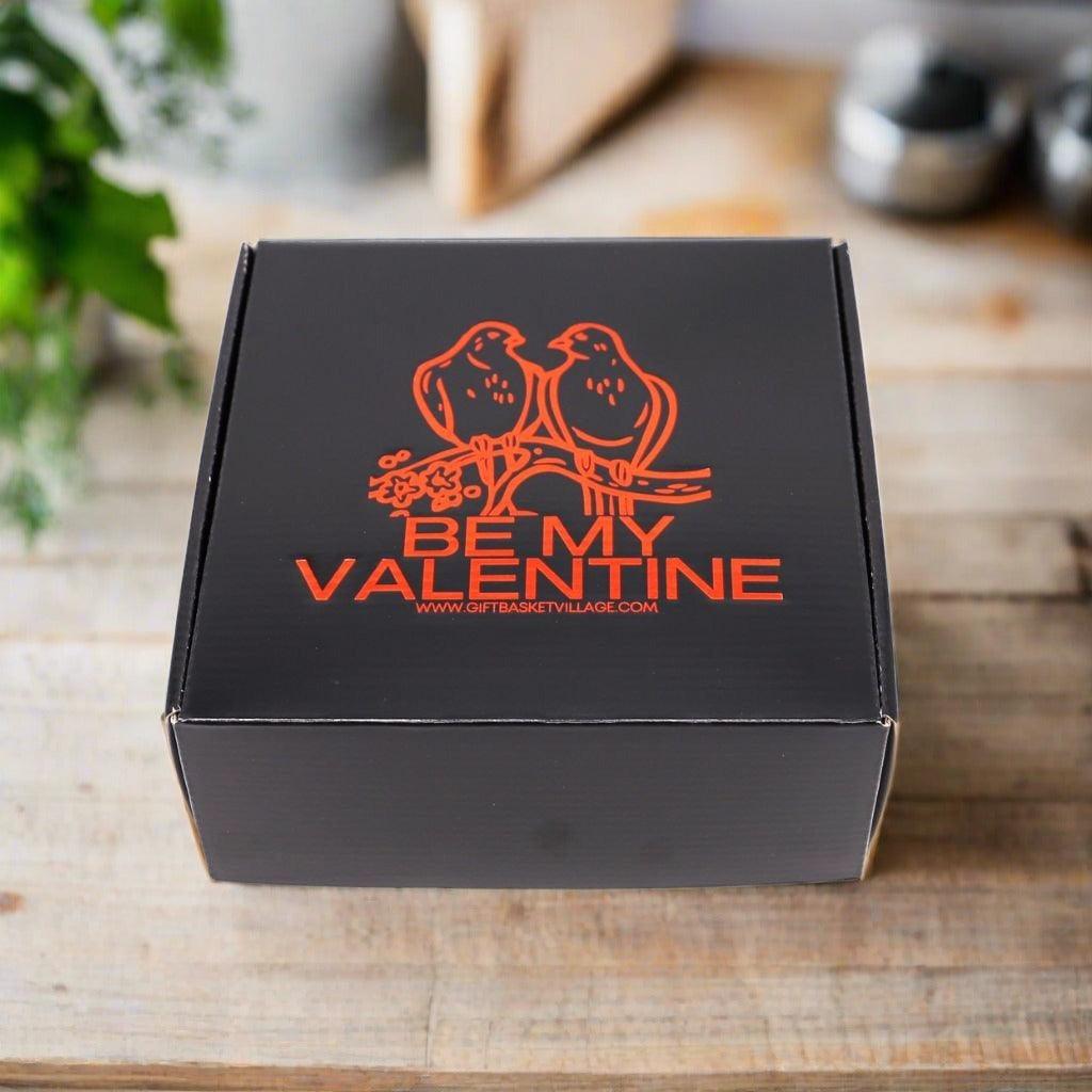 Valentine gift box with black lid and orange "BE MY VALENTINE" logo