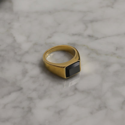 Gold PVD signet ring with square black onyx-style stone, wide band