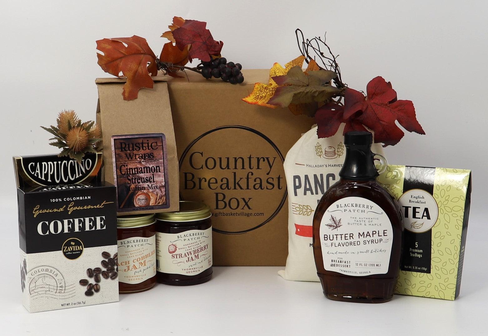 Breakfast gift box with assorted fall-themed pantry items, jars, and packets