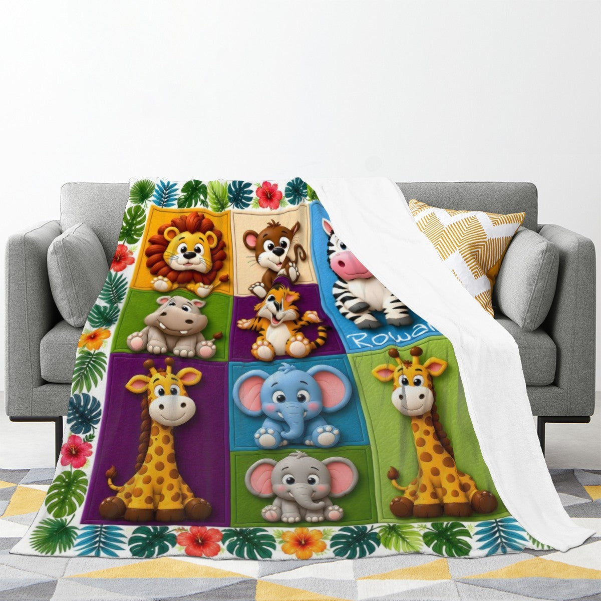 Safari animal kids blanket draped over a couch, showing lion, tiger, elephant, zebra panels.