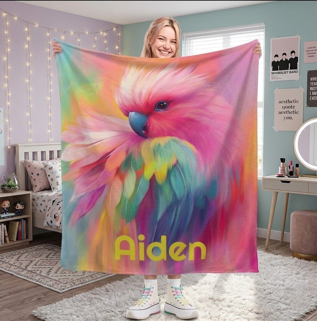 Personalized parrot name blanket with colorful feather artwork and yellow name text