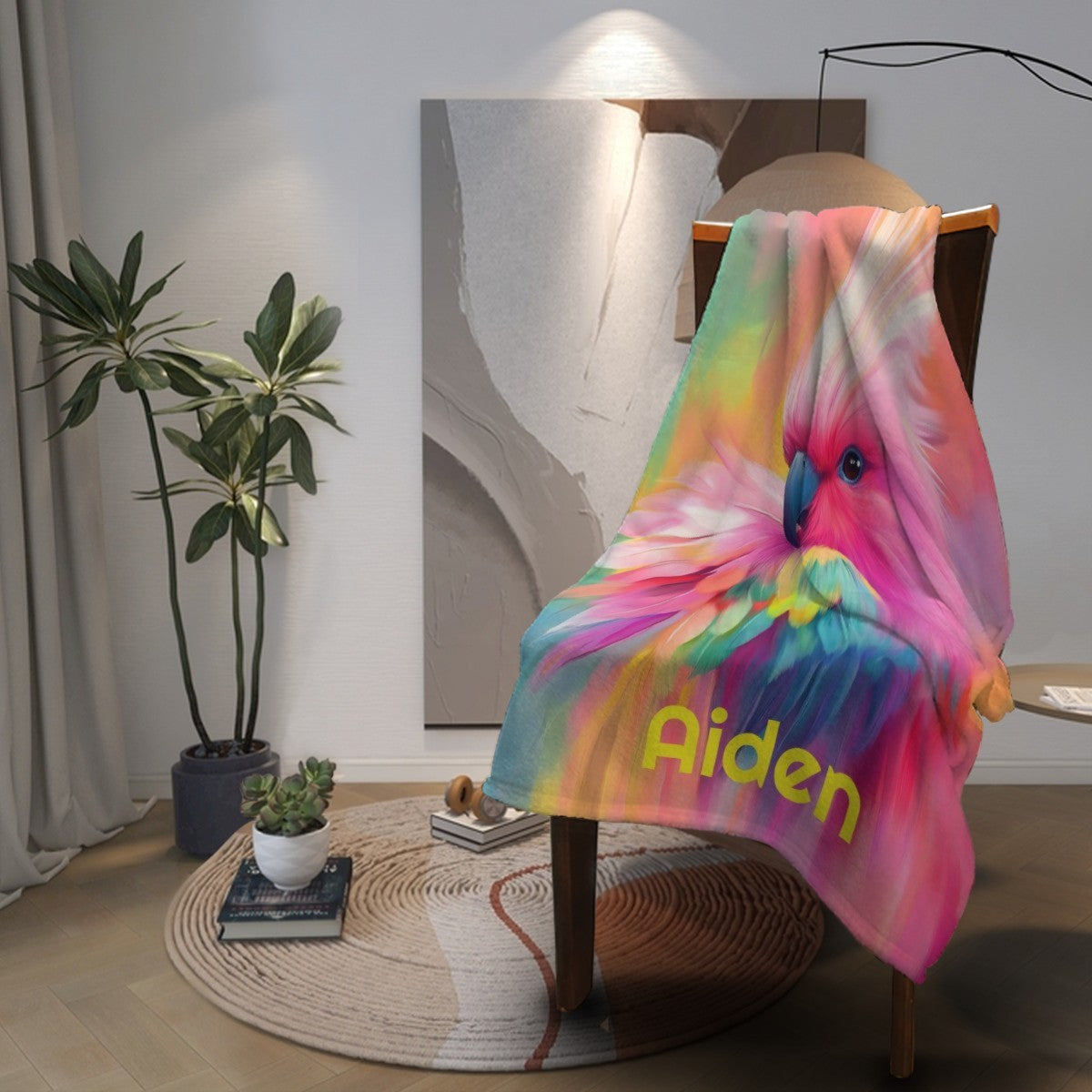 Personalized parrot name blanket draped on chair, rainbow bird design and name text