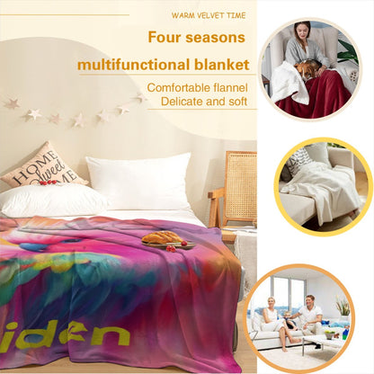 Personalized parrot name blanket shown as a soft flannel quilt with rainbow bird print