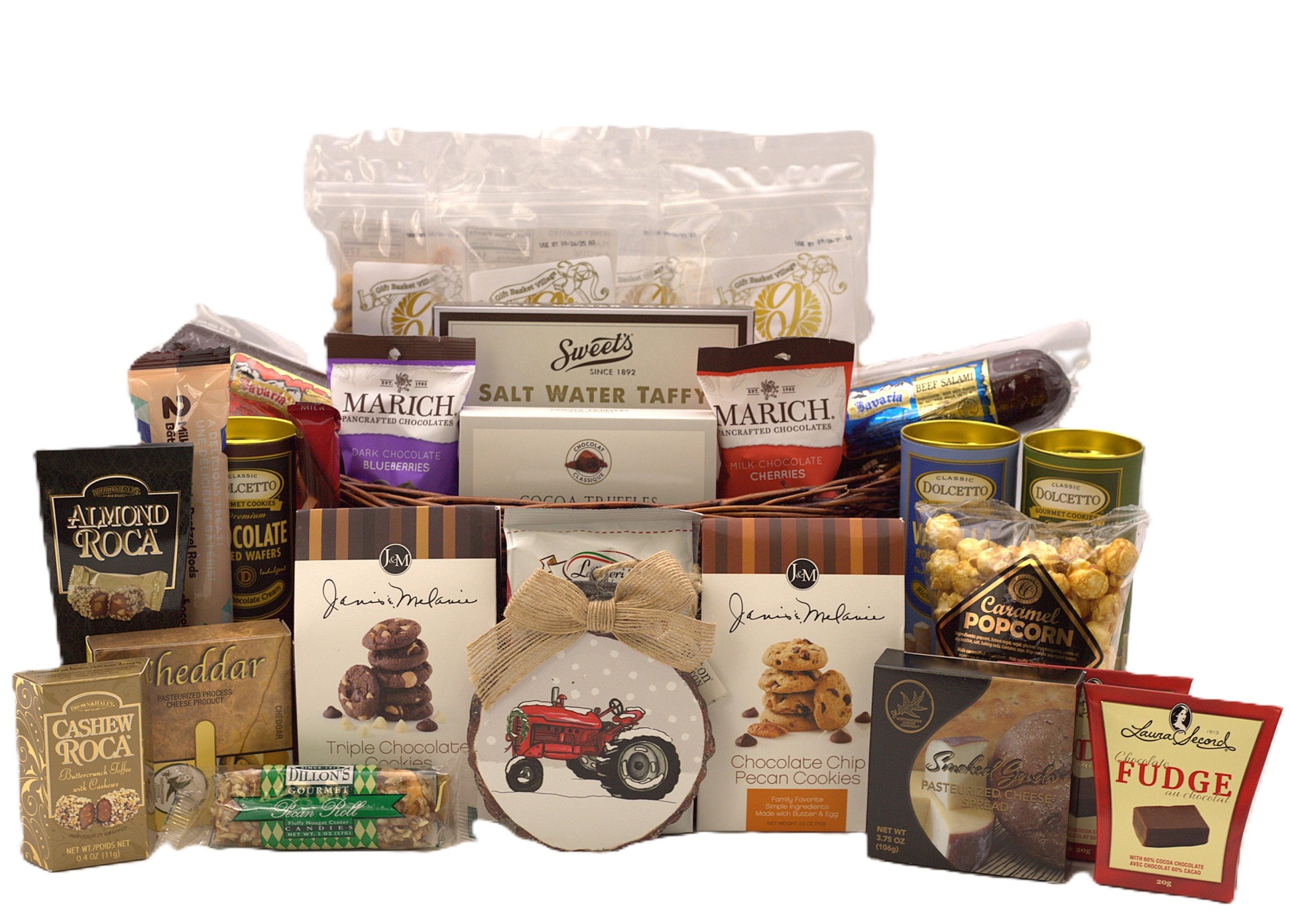Assorted Christmas gift basket with wrapped chocolates, cookies, and a decorative bow.