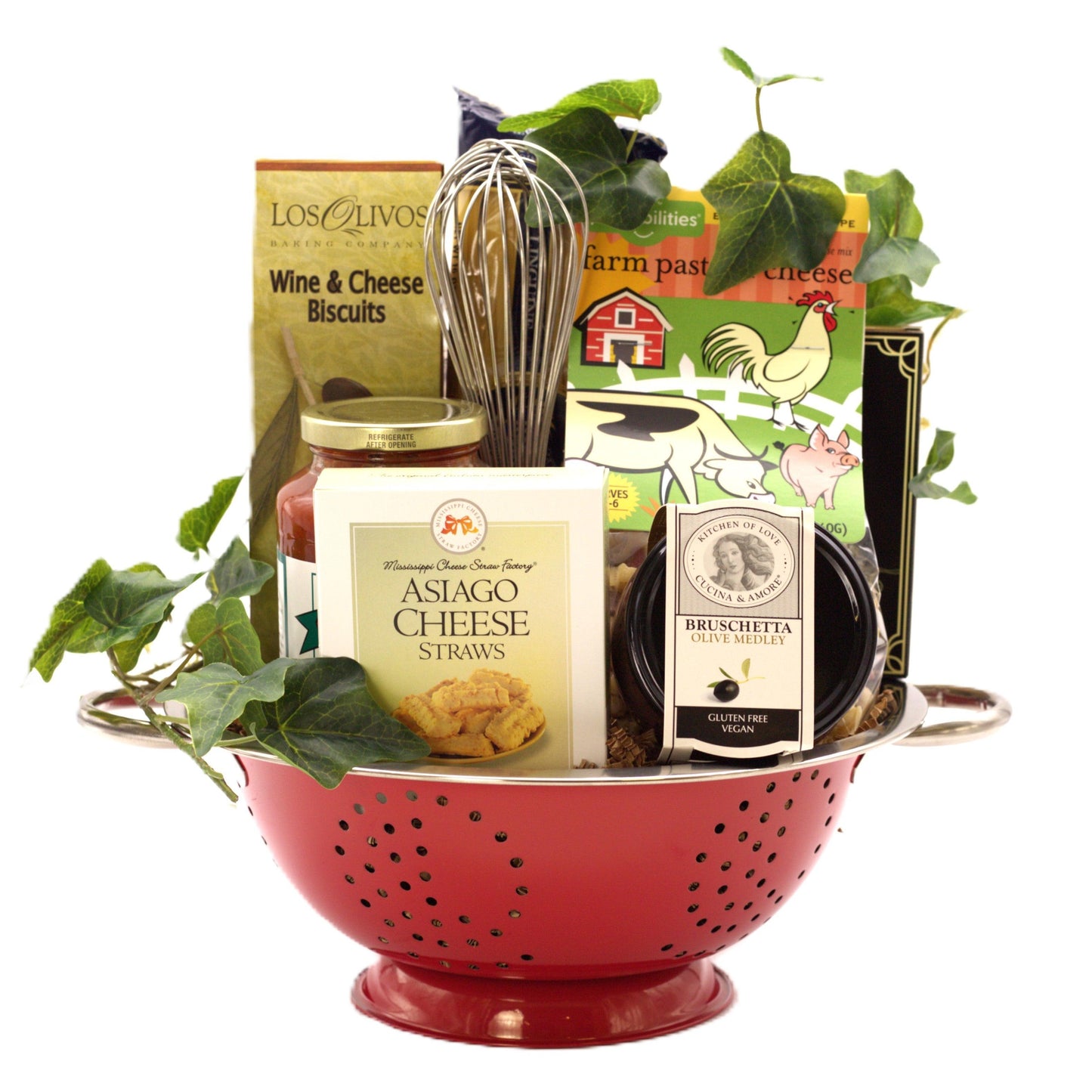 Italian gift basket in a red colander with cheese straws, bruschetta, and pasta