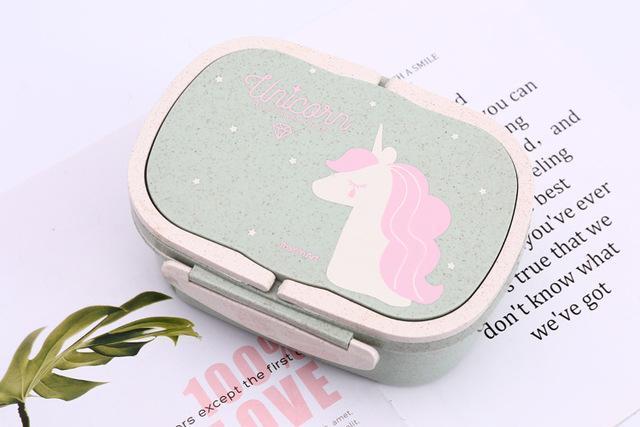 Green unicorn bento lunch box with starry lid and unicorn illustration