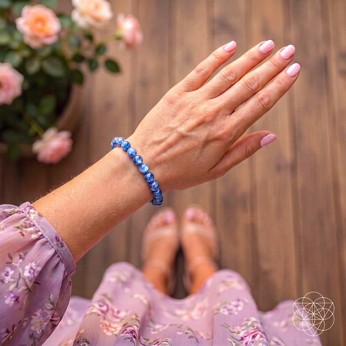 Rare kyanite beaded bracelet on hand, featuring round deep-blue kyanite beads