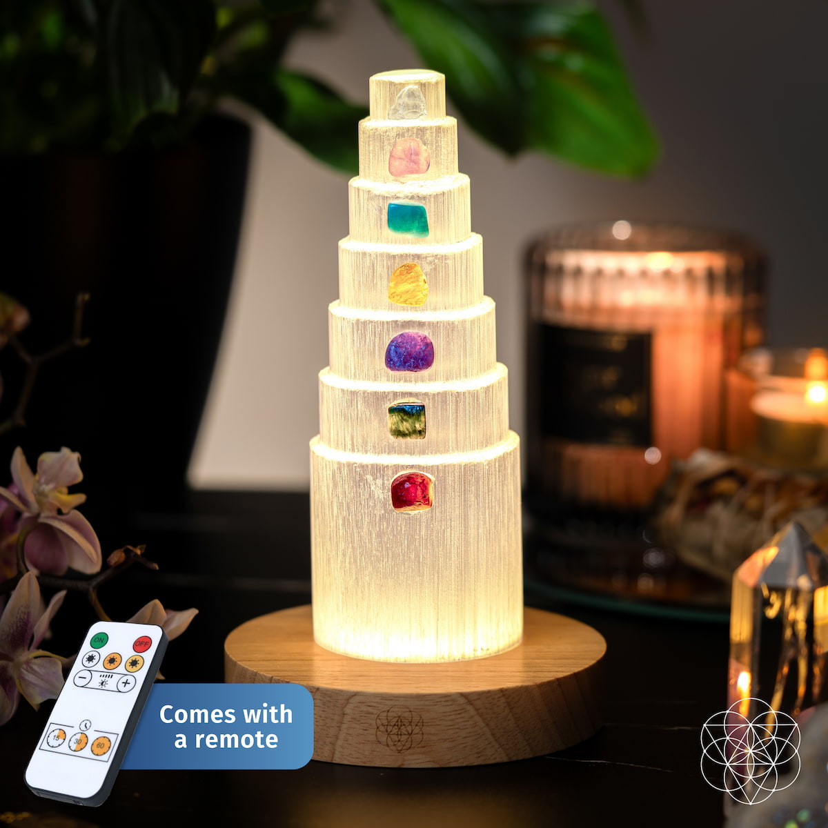 Glowing crystal stack lamp with multicolor stone insets on round wood base
