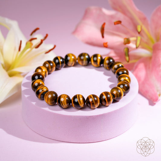 Tiger’s eye bead bracelet with round dark and amber stones on a wristband display