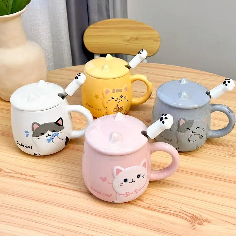 Collection of pastel cat lidded mugs with different colors on a wooden table