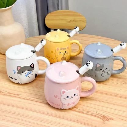 Collection of pastel cat lidded mugs with different colors on a wooden table