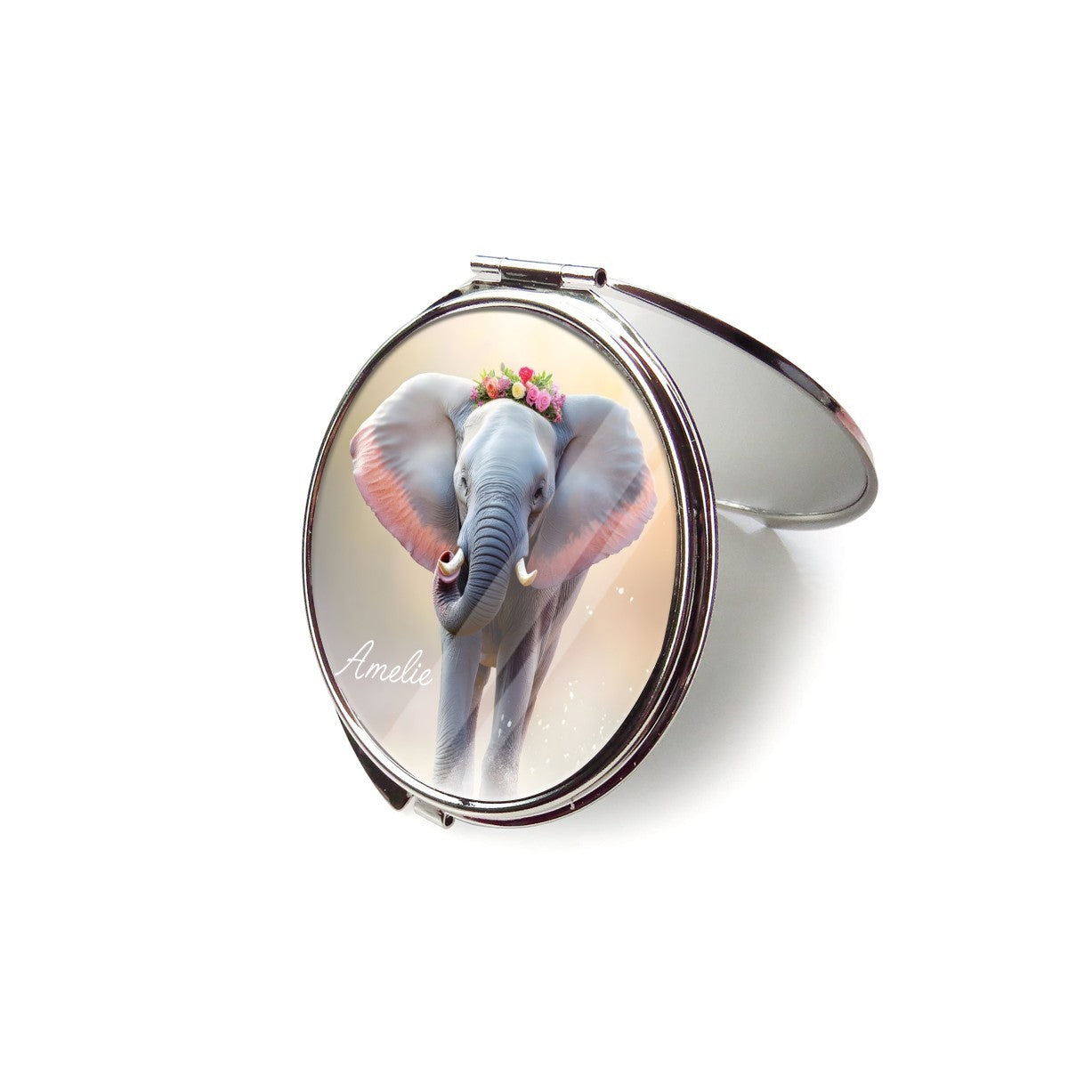 Open silver compact mirror with a floral elephant design on the lid.