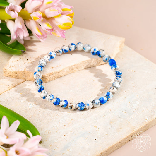 Blue and white stone beaded bracelet with round polished beads, stretchy fit