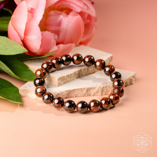 Mahogany and obsidian beaded bracelet with glossy brown and black round stones