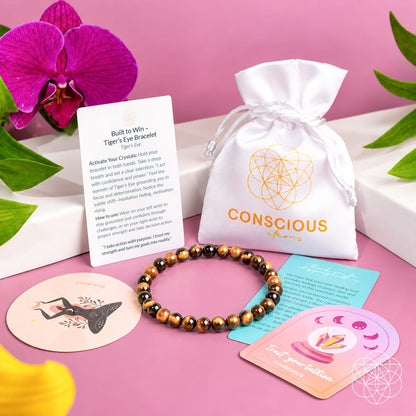 Tiger’s eye bead bracelet displayed with product cards and white drawstring pouch