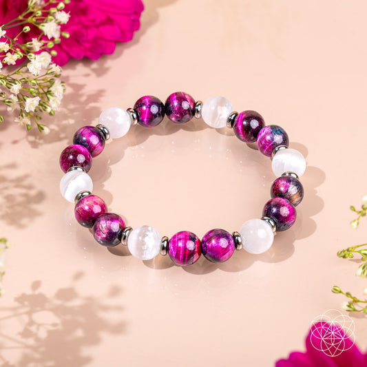 Beaded bracelet with magenta-purple tiger’s eye-style beads and white round stones.