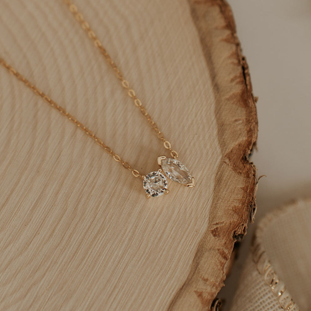 Gold chain necklace with two clear cubic zirconia stones in round and marquise cuts