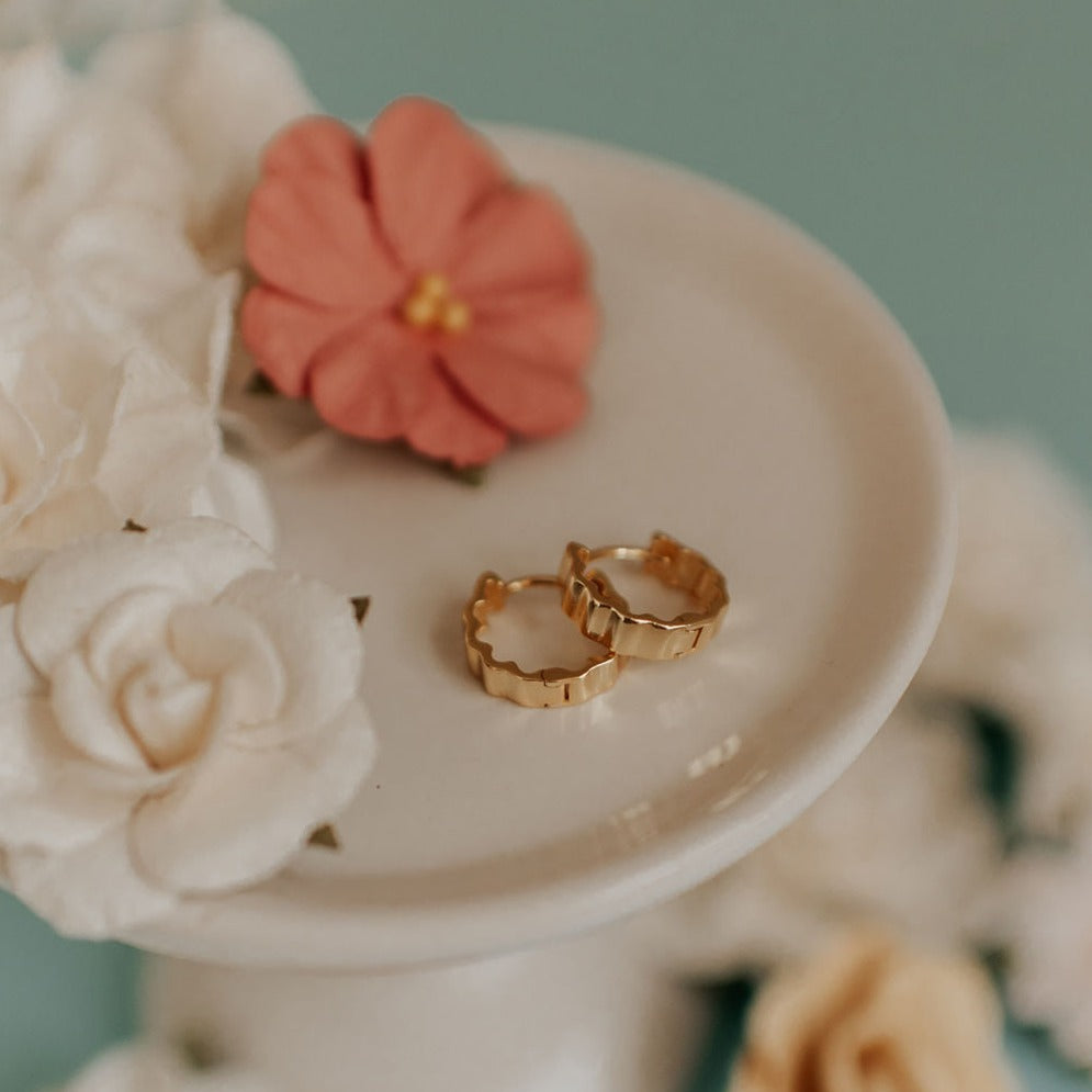 Pair of gold Tate hoop earrings with softly scalloped, ridged edges.