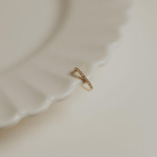 Gold-tone Jane Diamond Ear Cuff with small stones along the curved band