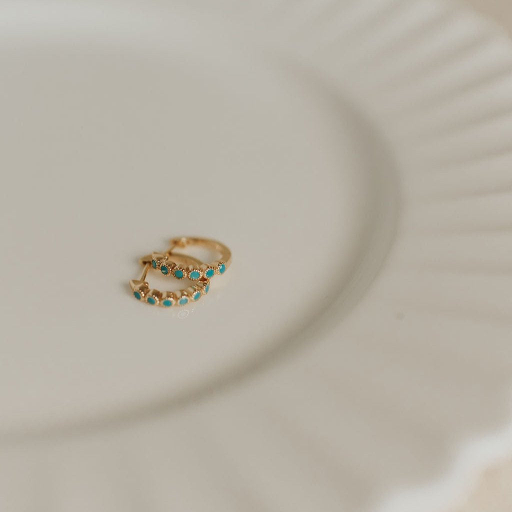 Gaby turquoise hoops with gold-tone bands and blue-green stones